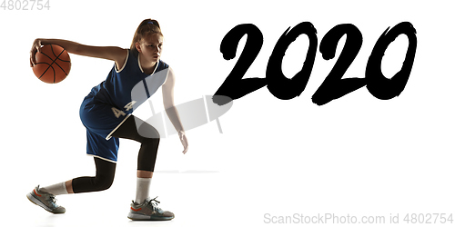 Image of Young caucasian female basketball player on white studio background