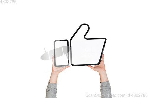 Image of Hands holding the sign of like on white studio background