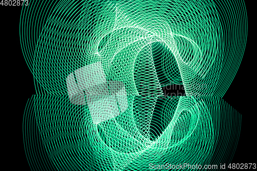 Image of Bright neon line designed background, shot with long exposure, green