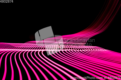 Image of Bright neon line designed background, shot with long exposure, pink