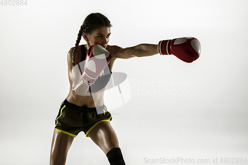 Image of Fit caucasian woman in sportswear boxing isolated on white studio background