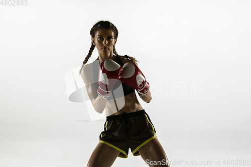 Image of Fit caucasian woman in sportswear boxing isolated on white studio background