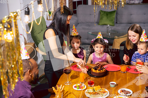 Image of Portrait of happy family celebrating a birthday at home