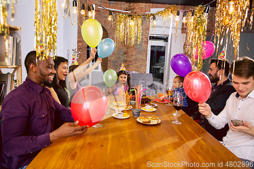 Image of Portrait of happy family celebrating a birthday at home