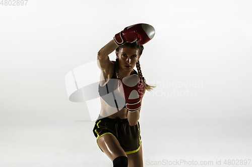 Image of Fit caucasian woman in sportswear boxing isolated on white studio background