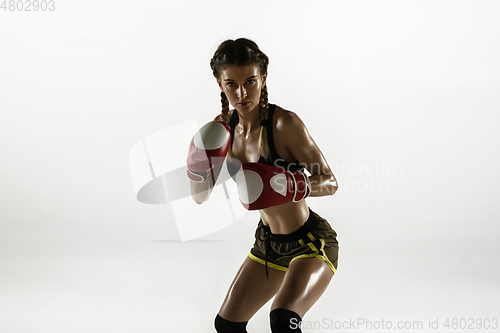 Image of Fit caucasian woman in sportswear boxing isolated on white studio background