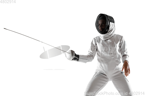 Image of Teen girl in fencing costume with sword in hand isolated on white background