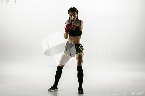 Image of Fit caucasian woman in sportswear boxing isolated on white studio background