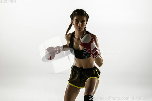 Image of Fit caucasian woman in sportswear boxing isolated on white studio background