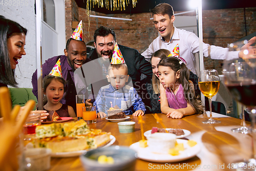 Image of Portrait of happy family celebrating a birthday at home