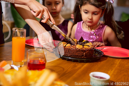 Image of Portrait of happy family celebrating a birthday at home