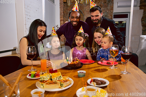 Image of Portrait of happy family celebrating a birthday at home