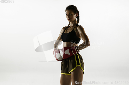 Image of Fit caucasian woman in sportswear boxing isolated on white studio background
