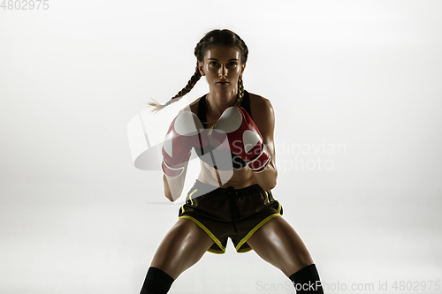 Image of Fit caucasian woman in sportswear boxing isolated on white studio background