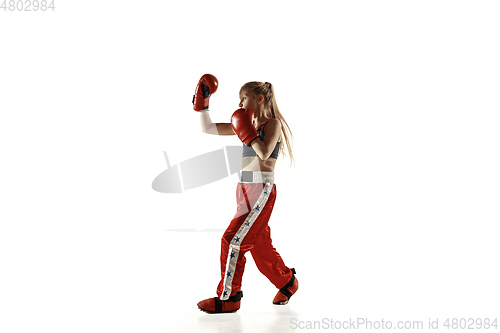 Image of Young female kickboxing fighter training isolated on white background