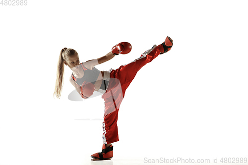 Image of Young female kickboxing fighter training isolated on white background