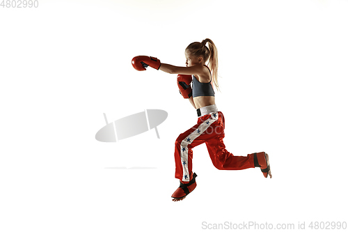 Image of Young female kickboxing fighter training isolated on white background