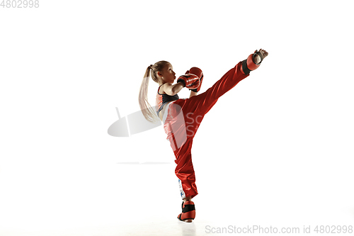 Image of Young female kickboxing fighter training isolated on white background