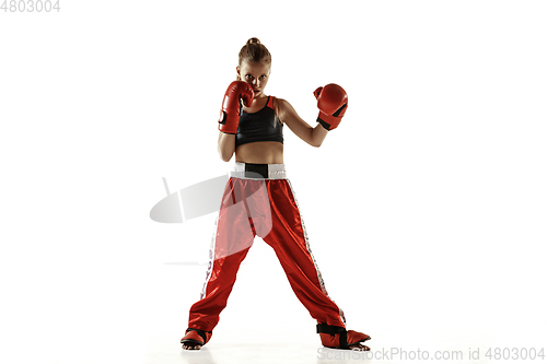 Image of Young female kickboxing fighter training isolated on white background