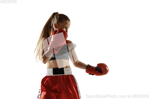 Image of Young female kickboxing fighter training isolated on white background