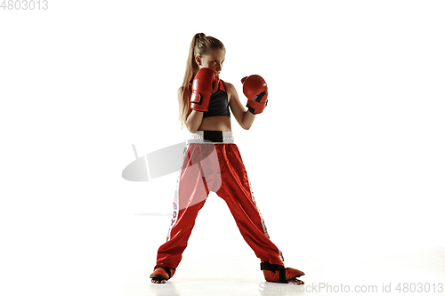 Image of Young female kickboxing fighter training isolated on white background