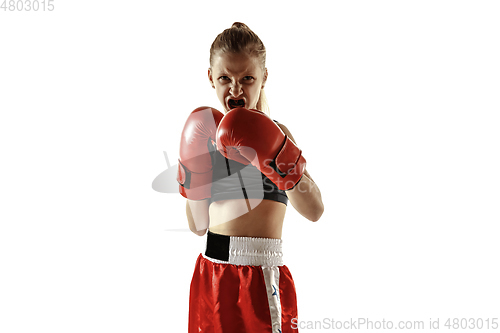 Image of Young female kickboxing fighter training isolated on white background