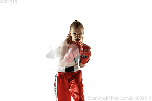 Image of Young female kickboxing fighter training isolated on white background