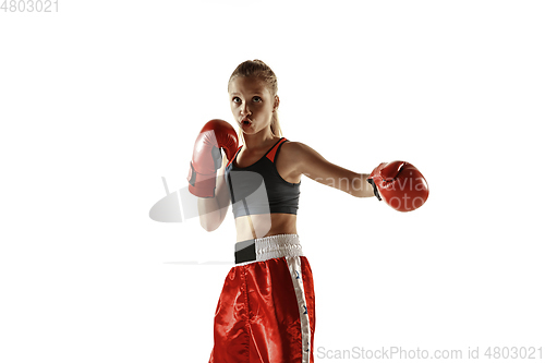 Image of Young female kickboxing fighter training isolated on white background