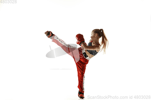 Image of Young female kickboxing fighter training isolated on white background