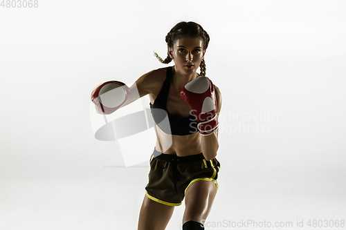 Image of Fit caucasian woman in sportswear boxing isolated on white studio background