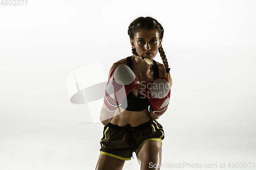 Image of Fit caucasian woman in sportswear boxing isolated on white studio background