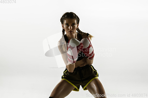 Image of Fit caucasian woman in sportswear boxing isolated on white studio background