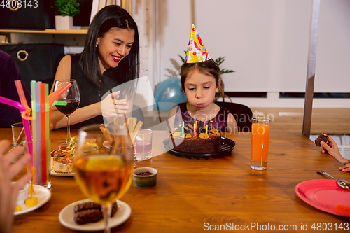 Image of Mother and daughter celebrating a birthday at home