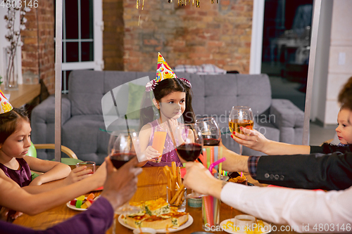 Image of Portrait of happy family celebrating a birthday at home