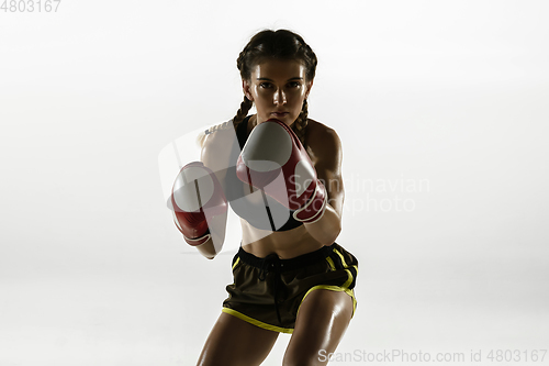 Image of Fit caucasian woman in sportswear boxing isolated on white studio background