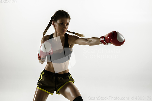 Image of Fit caucasian woman in sportswear boxing isolated on white studio background