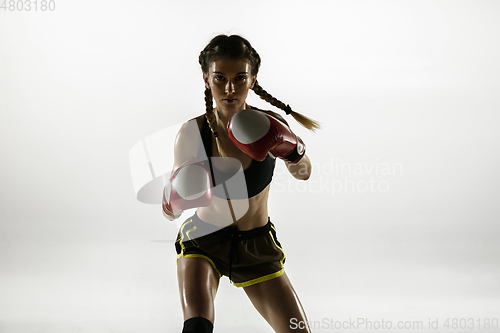 Image of Fit caucasian woman in sportswear boxing isolated on white studio background