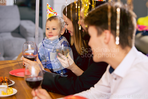 Image of Portrait of happy family celebrating a birthday at home