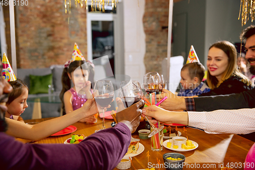 Image of Portrait of happy family celebrating a birthday at home