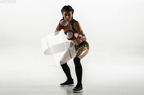 Image of Fit caucasian woman in sportswear boxing isolated on white studio background