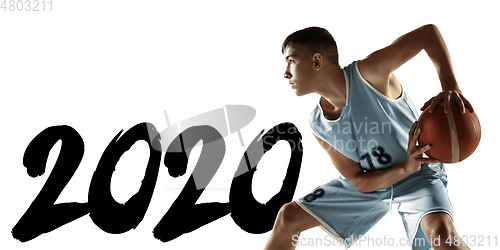 Image of Full length portrait of a young basketball player with ball, meeting 2020