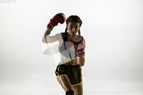 Image of Fit caucasian woman in sportswear boxing isolated on white studio background