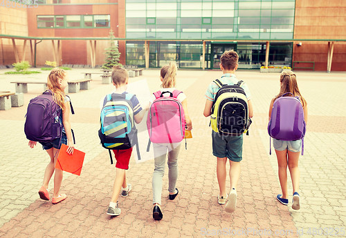 Image of group of happy elementary school students walking