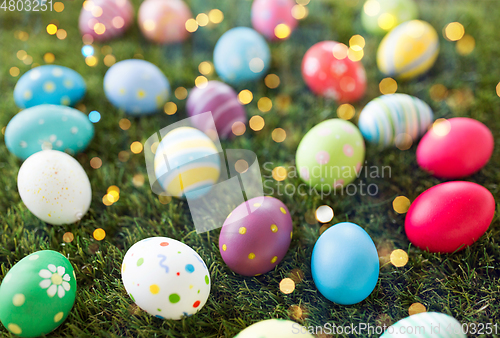 Image of colored easter eggs on artificial grass