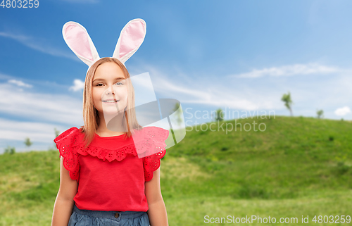 Image of happy girl wearing easter bunny ears headband