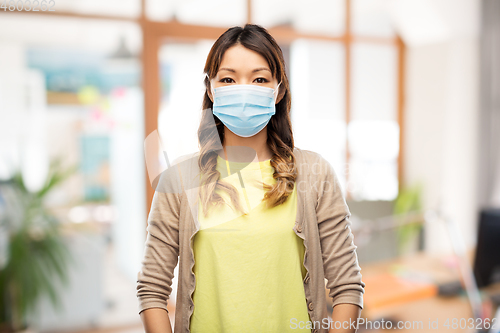 Image of asian young woman in protective medical mask