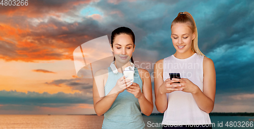 Image of women or female friends with smartphones