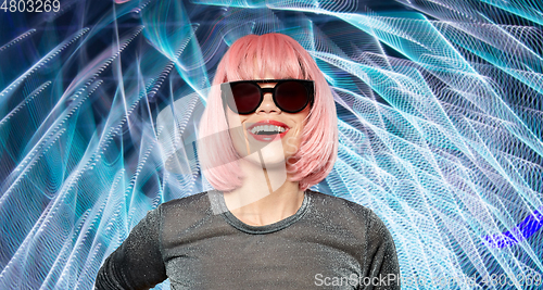 Image of happy woman in pink wig and black sunglasses