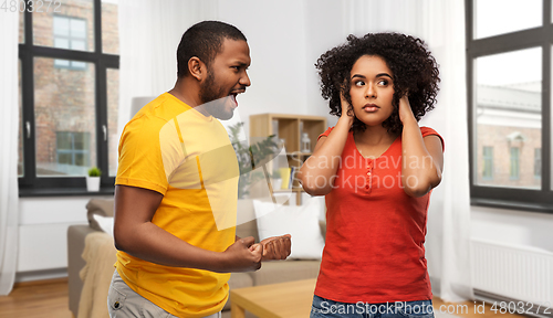 Image of african american couple having argument at home