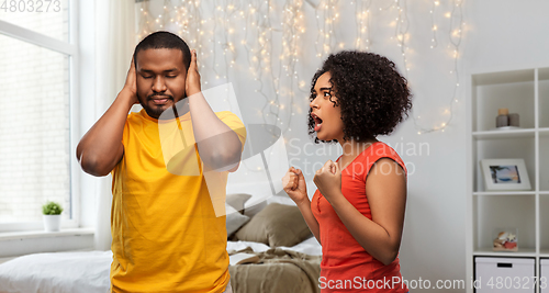 Image of african american couple having argument at home